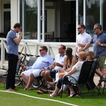 Attenborough Cricket Club people talking by pitch side